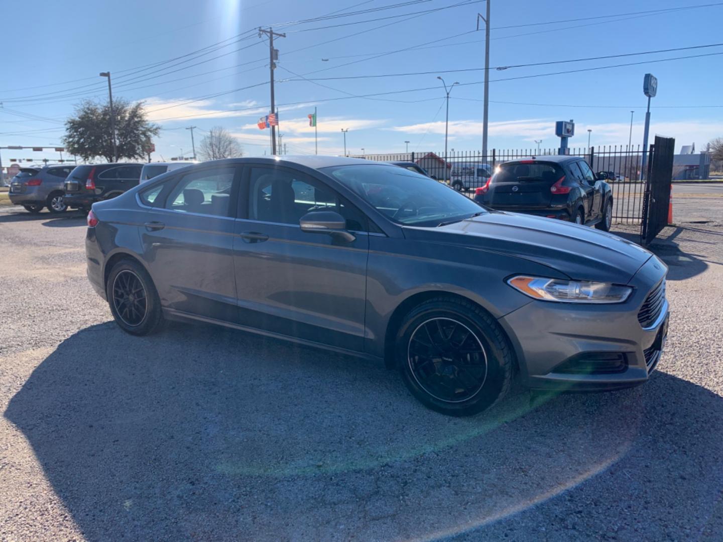 2013 Black /Black Ford Fusion (3FA6P0H79DR) with an 4 Cylinders D 1.5L DI Turbo DOHC 091 CID engine, AUTOMATIC transmission, located at 1830 North Belt Line Road, Irving, TX, 75061, (469) 524-0199, 32.834373, -96.993584 - Photo#8